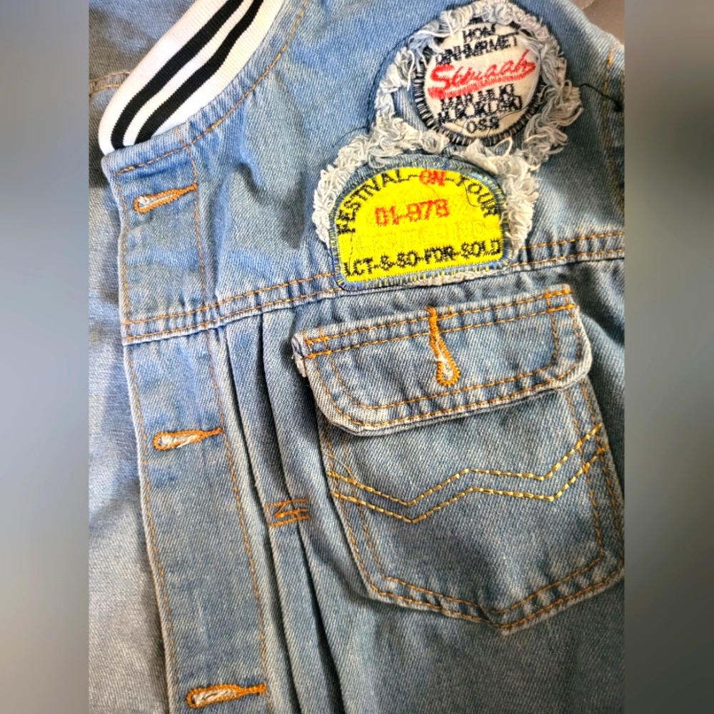 Jean jacket with patch work. Large light blue Jean jacket with Patchwork sleeves